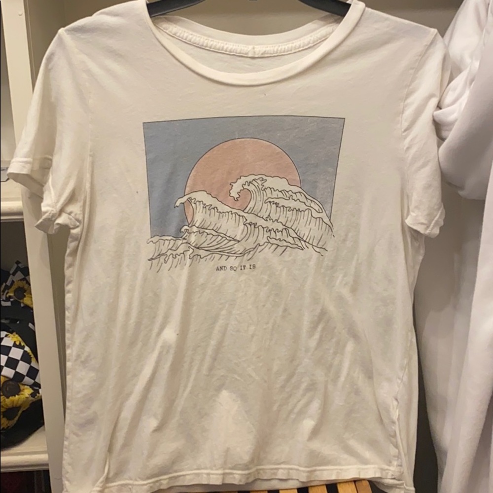 “AND SO IT IS” wave t-shirt.